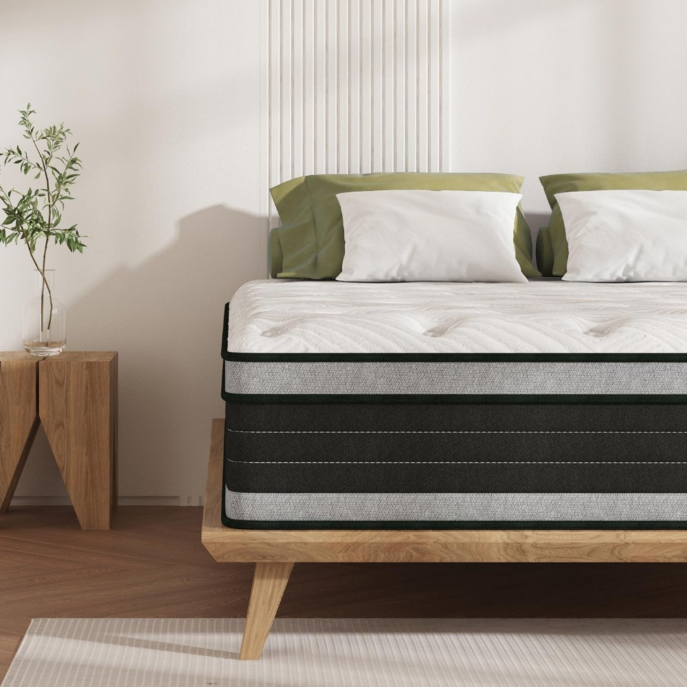 Mattress on platform bed with white tufted top, green and white pillows
